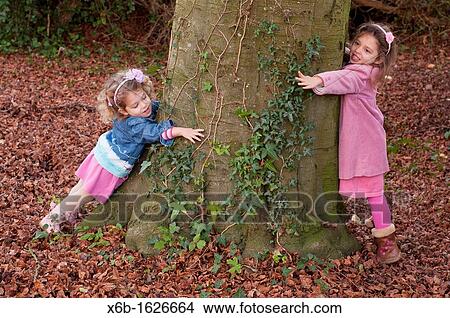Sisters playing View Large Photo Image Picture - Sisters playing. Fotosearch