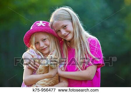 sisters with kitten View Large Photo Image Stock Photo - sisters with kitten. Fotosearch