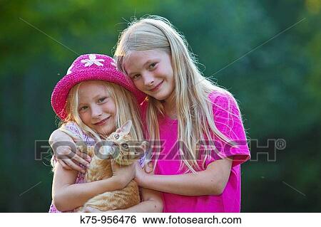 sisters with kitten View Large Photo Image Stock Photograph - sisters with kitten. Fotosearch