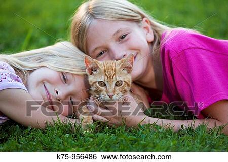 sisters with kitten View Large Photo Image Stock Photograph - sisters with kitten. Fotosearch