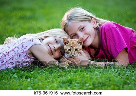 sisters with kitten View Large Photo Image Stock Photograph - sisters with kitten. Fotosearch