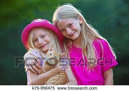 sisters with kitten View Large Photo Image Stock Photography - sisters with kitten. Fotosearch