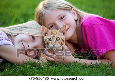 sisters with kitten View Large Photo Image Stock Photography - sisters with kitten. Fotosearch