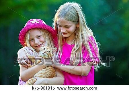 sisters with kitten View Large Photo Image Stock Photography - sisters with kitten. Fotosearch