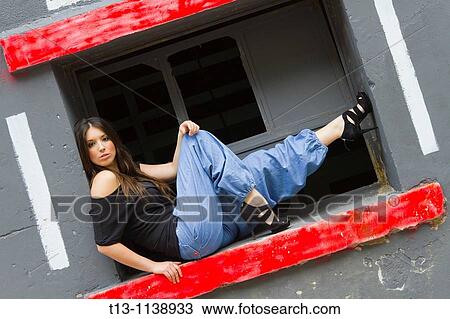 Sitting and posing young woman in balloon pants View Large Photo Image Stock Image - Sitting and posing young woman in balloon pants. Fotosearch