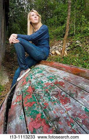Sitting on an old and derelict wooden boat View Large Photo Image Stock Image - Sitting on an old and derelict wooden boat. Fotosearch
