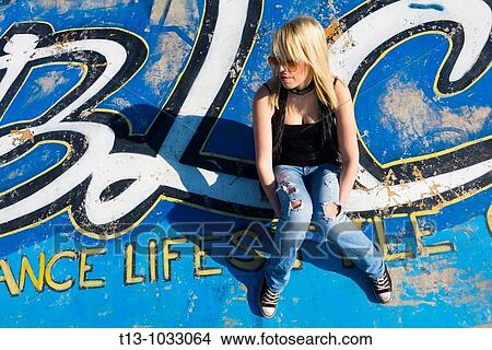 Sitting on colorful concrete floor in a park View Large Photo Image Picture - Sitting on colorful concrete floor in a park. Fotosearch