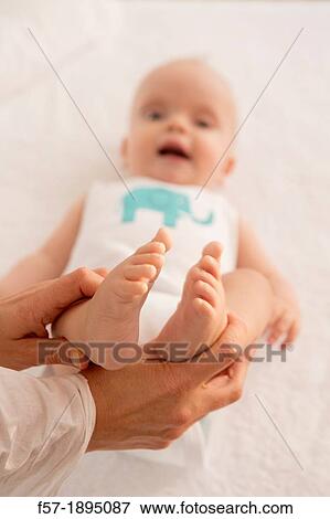 Stock Photo - Six month old babies feet. Fotosearch