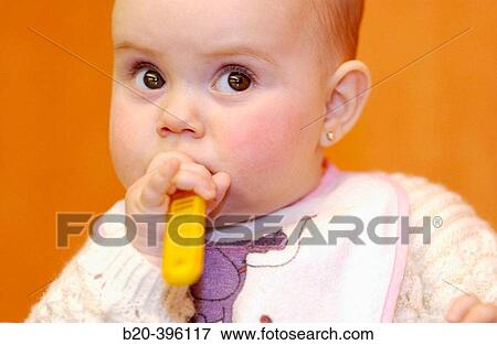 Six months old baby eating. View Large Photo Image Stock Photo - Six months old baby eating.. Fotosearch