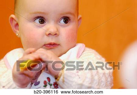 Six months old baby eating. View Large Photo Image Stock Photograph - Six months old baby eating.. Fotosearch