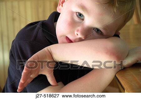 Six-year old bashful boy View Large Photo Image Stock Photo - Six-year old bashful boy. Fotosearch
