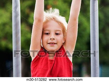 Six years old caucasian boy playing at the park. View Large Photo Image Stock Image - Six years old caucasian boy playing at the park.. Fotosearch