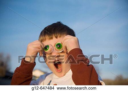 Six_year old boy with fake big eyes gestures with mouth open. View Large Photo Image Picture - Six_year old boy with fake big eyes gestures with mouth open.. Fotosearch