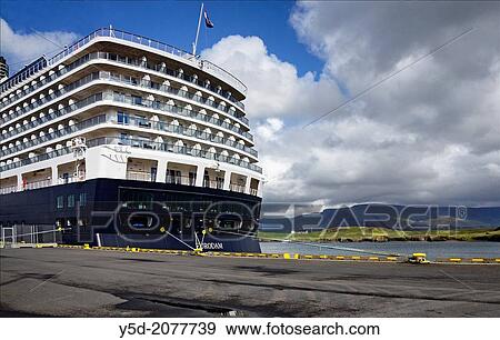 Stock Photo - Skarfabakki harbor in Reykjavik is the port where thousands of passengers arrive to Iceland each year with huge cruise liners, Videy Island in the background.. Fotosearch