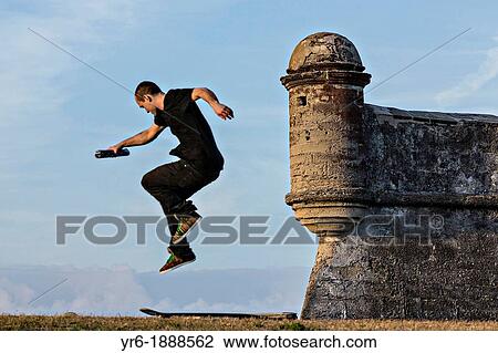 Stock Image - Skate boarder at the Castillo de San Marcos in St Augustine, Florida St Augustine is the oldest city in America. Fotosearch