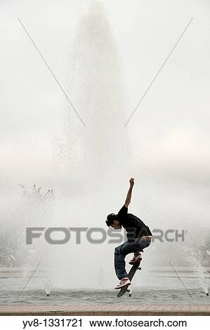 Stock Image - Skateboarder in Balboa park, San Diego, California. Fotosearch