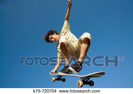 Skateboarder in the air View Large Photo Image Picture - Skateboarder in the air. Fotosearch