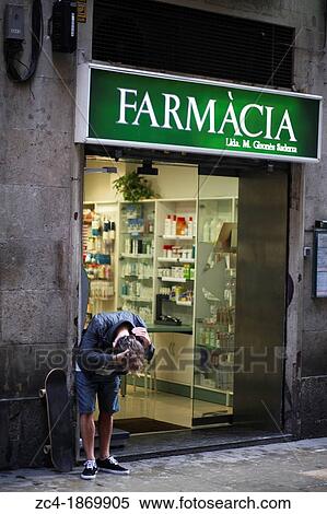 Stock Photography - Skateboarder visiting drugstore after accident. Fotosearch