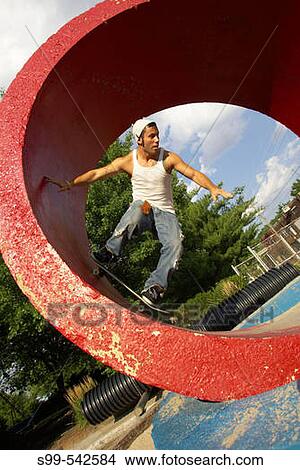 Skater skateboarding in tube at a skate park in Kansas City, Missouri, USA View Large Photo Image Picture - Skater skateboarding in tube at a skate park in Kansas City, Missouri, USA. Fotosearch