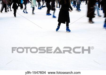 Skaters maneuver the packed Pond at Bryant Park ice skating rink in New York View Large Photo Image Picture - Skaters maneuver the packed Pond at Bryant Park ice skating rink in New York. Fotosearch