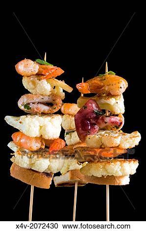 Skewers of cauliflower, squid and shrimp. View Large Photo Image Stock Image - Skewers of cauliflower, squid and shrimp.. Fotosearch
