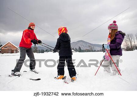 Ski lesson - family on snow, Slovenian alps. View Large Photo Image Stock Image - Ski lesson - family on snow, Slovenian alps.. Fotosearch