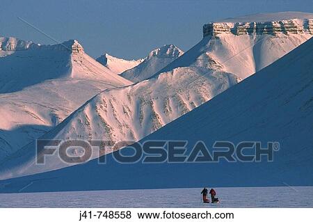 Ski tourers spring ski traverse Ny Alesund to Longyearbyen Spitsbergen Island Svalbard Norwegian Arctic View Large Photo Image Stock Photo - Ski tourers spring ski traverse Ny Alesund to Longyearbyen Spitsbergen Island Svalbard Norwegian Arctic. Fotosearch