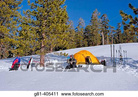 Skier drinking from a bottle in front of a yellow dome tent in a backcountry ski camp, Yosemite National Park, California View Large Photo Image Stock Image - Skier drinking from a bottle in front of a yellow dome tent in a backcountry ski camp, Yosemite National Park, California. Fotosearch