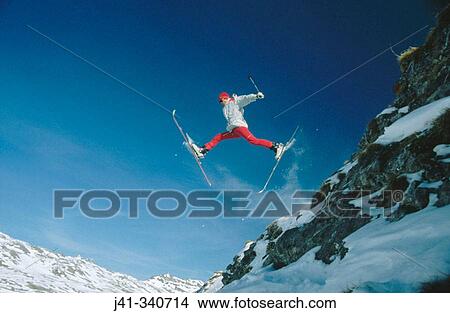 Skier jumping. European Alps View Large Photo Image Picture - Skier jumping. European Alps. Fotosearch