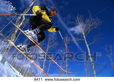 Skier jumping in trees View Large Photo Image Stock Image - Skier jumping in trees. Fotosearch