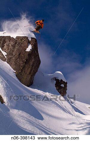 Skier jumping off a cliff on Donner Summit, California. USA View Large Photo Image Stock Image - Skier jumping off a cliff on Donner Summit, California. USA. Fotosearch