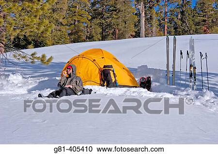 Skier using a radio and yellow dome tent in a backcountry ski camp, Yosemite National Park, California View Large Photo Image Stock Image - Skier using a radio and yellow dome tent in a backcountry ski camp, Yosemite National Park, California. Fotosearch