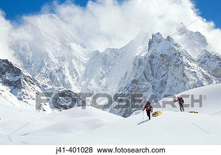 Skiers hauling sleds under Gasherbrum IV, Godwin-Austen glacier. Karakoram mountains, Pakistan View Large Photo Image Stock Photo - Skiers hauling sleds under Gasherbrum IV, Godwin-Austen glacier. Karakoram mountains, Pakistan. Fotosearch