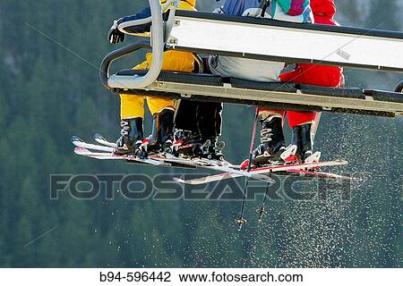 Skiers on chairlift. La Molina ski resort. Cerdanya. Girona. Catalonia, Spain View Large Photo Image Stock Image - Skiers on chairlift. La Molina ski resort. Cerdanya. Girona. Catalonia, Spain. Fotosearch