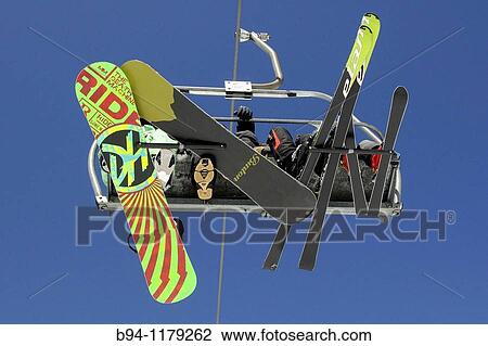 Skiers on chairlifts. La Molina ski resort, Girona province, Catalonia, Spain View Large Photo Image Stock Image - Skiers on chairlifts. La Molina ski resort, Girona province, Catalonia, Spain. Fotosearch