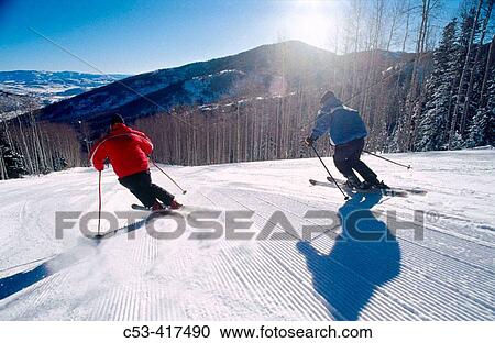 Skiing. Men on a groomer at The Canyons. Utah. USA View Large Photo Image Stock Image - Skiing. Men on a groomer at The Canyons. Utah. USA. Fotosearch