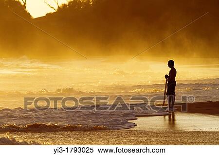 Skimboarder at sunset at Makena, Maui, Hawaii View Large Photo Image Stock Photography - Skimboarder at sunset at Makena, Maui, Hawaii. Fotosearch