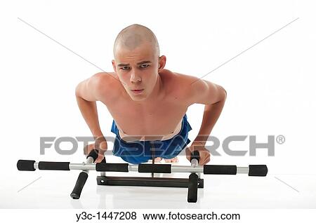 Skinny male teenager working out View Large Photo Image Stock Photo - Skinny male teenager working out. Fotosearch