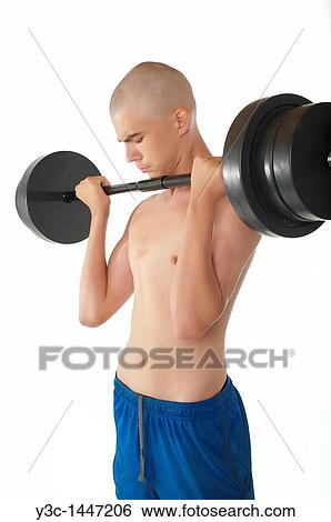 Skinny male teenager working out View Large Photo Image Stock Photograph - Skinny male teenager working out. Fotosearch