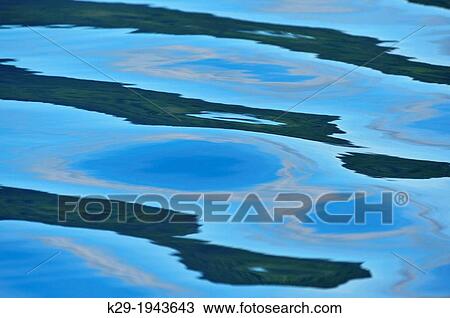 Sky reflections in calm seas (Burnaby Strait), Haida Gwaii (Queen Charlotte Islands) Gwaii Haanas NP, British Columbia, Canada. View Large Photo Image Stock Image - Sky reflections in calm seas (Burnaby Strait), Haida Gwaii (Queen Charlotte Islands) Gwaii Haanas NP, British Columbia, Canada.. Fotosearch