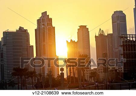 Skyscrapers from The Dubai Fountain, Dubai, United Arab Emirates at sunset View Large Photo Image Stock Photo - Skyscrapers from The Dubai Fountain, Dubai, United Arab Emirates at sunset. Fotosearch