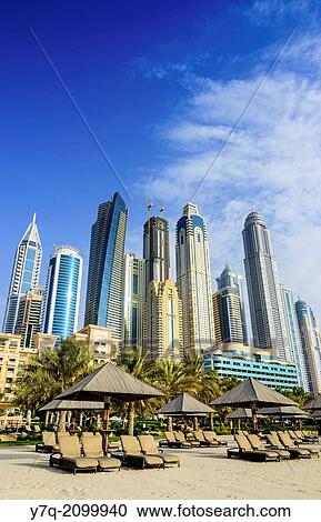 Stock Image - Skyscrapers of Dubai Marina tower above The Westin Dubai Mina Seyahi Beach Resort Hotel, Dubai, UAE.. Fotosearch