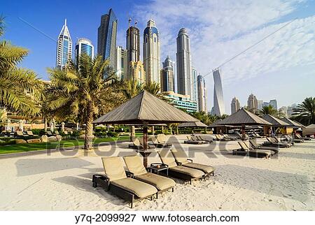 Skyscrapers of Dubai Marina tower above The Westin Dubai Mina Seyahi Beach Resort Hotel, Dubai, UAE. View Large Photo Image Stock Photo - Skyscrapers of Dubai Marina tower above The Westin Dubai Mina Seyahi Beach Resort Hotel, Dubai, UAE.. Fotosearch
