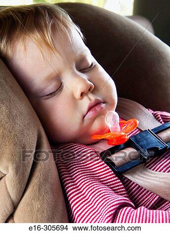 Sleeping baby in car seat View Large Photo Image Picture - Sleeping baby in car seat. Fotosearch