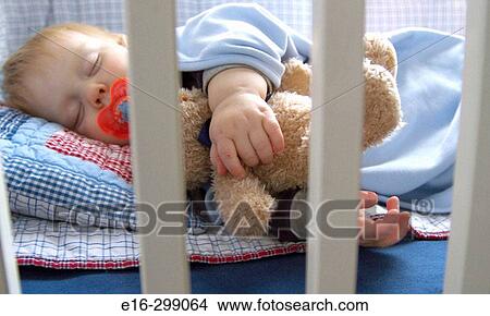 sleeping baby in crib View Large Photo Image Picture - sleeping baby in crib. Fotosearch
