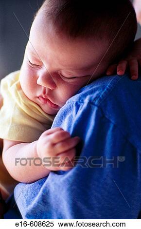 Sleeping on mother's shoulder View Large Photo Image Stock Photography - Sleeping on mother's shoulder. Fotosearch