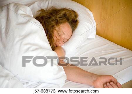 Sleeping woman in hotel. 30-35 years old. View Large Photo Image Stock Image - Sleeping woman in hotel. 30-35 years old.. Fotosearch