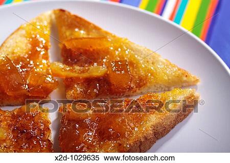Sliced toast with marmalade on a white plate View Large Photo Image Stock Photography - Sliced toast with marmalade on a white plate. Fotosearch