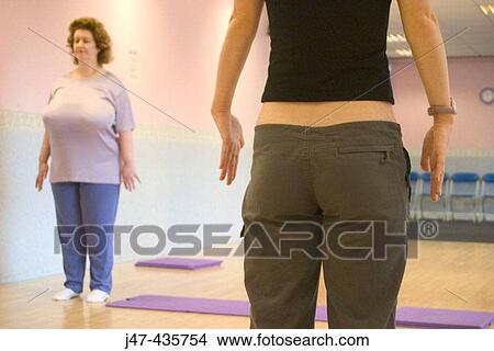 Slim lady and fat lady exercising View Large Photo Image Picture - Slim lady and fat lady exercising. Fotosearch