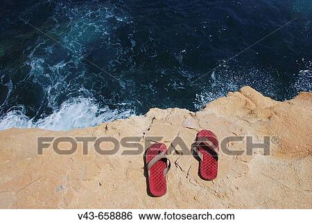 Slippers on cliff. Cabo de Gata, Almeria province, Andalucia, Spain View Large Photo Image Stock Photograph - Slippers on cliff. Cabo de Gata, Almeria province, Andalucia, Spain. Fotosearch